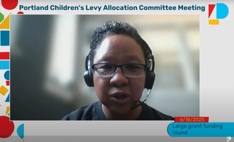 photo from June 18, 2025 PCL Allocation Committee meeting of committee member Felicia Tripp Folsom in a black shirt and headphones speaking during the meeting